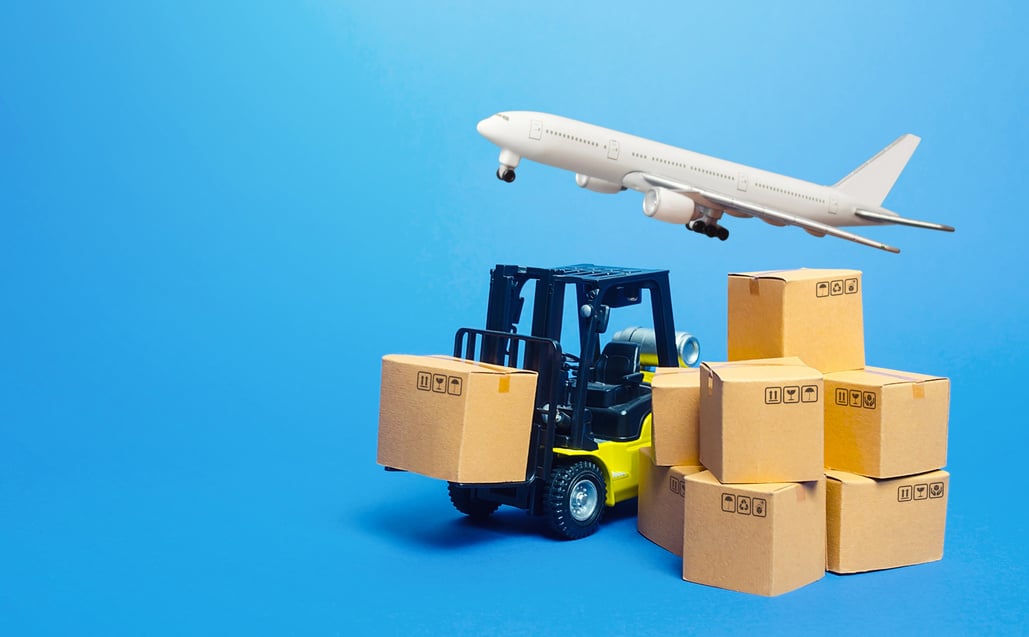 Forklift truck with cardboard boxes and freight plane. Transportation logistics infrastructure, import export goods, products delivery. Production, transport cargo. Air transportation shipping.